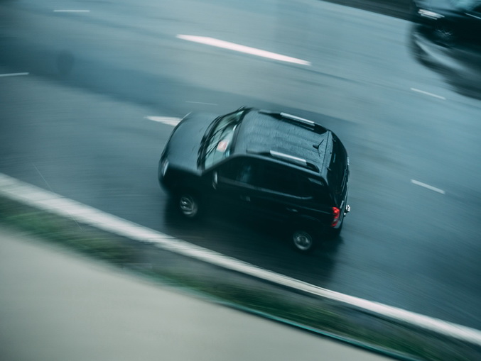 Aerial View of Black Suv Running on Road-min