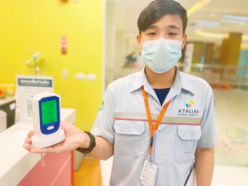 a man holding AQI detector